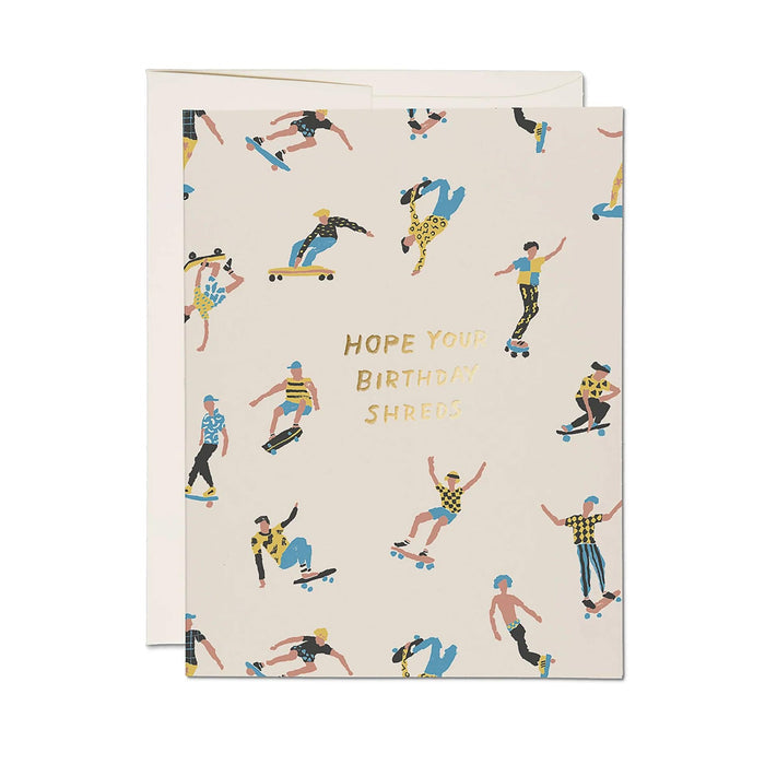 Birthday card with skater pattern and 'HOPE YOU BIRTHDAYS SHREDS' on cream, with envelope.