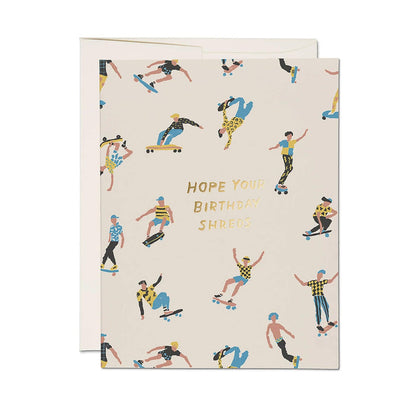 Birthday card with skater pattern and 'HOPE YOU BIRTHDAYS SHREDS' on cream, with envelope.