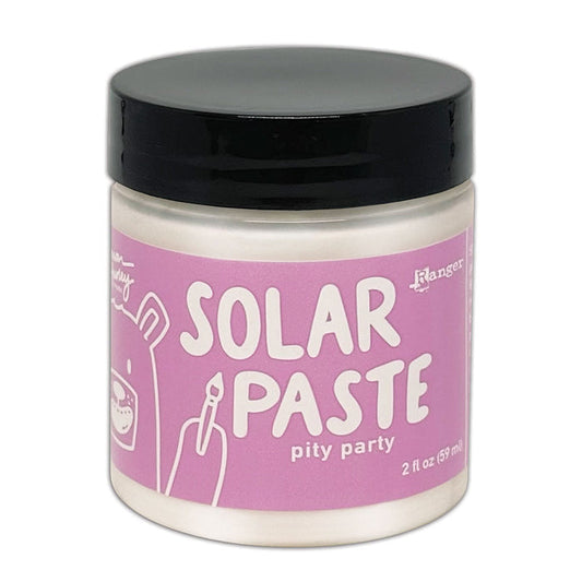 Simon Hurley  create. Solar Paste 2oz Pity Party. A white paste with a metallic color shift. Available at Embellish Away located in Bowmanville Ontario Canada.