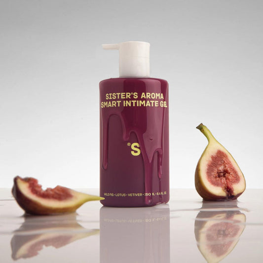 Bottle of 'Sister's Aroma Smart Intimate Gel' with figs on a reflective surface