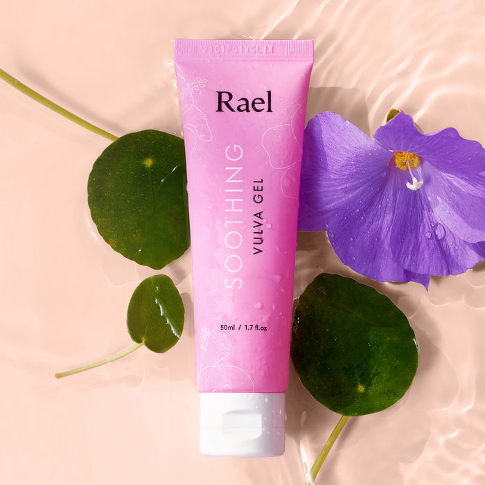 Rael Soothing Vulva Gel on a water background with a purple flower and green leaves.