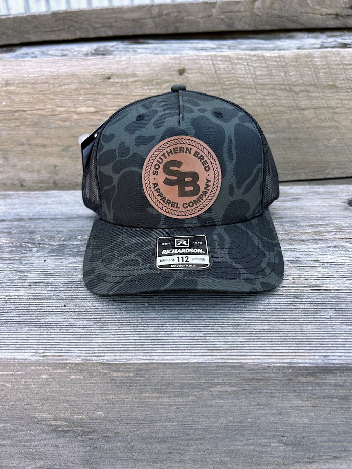 Southern Bred Caramel Leather Patch Richardson 112 Adjustable Snap Back Cap In Sable Duck Camo