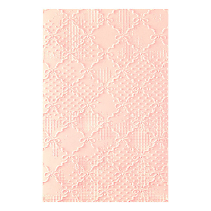 Spellbinders - 3D Embossing Folder - Ribbons & Seams. Approx. Size: 5.50 x 8.50 in./13.97 x 21.60 cm. Available at Embellish Away in Bowmanville Ontario Canada.