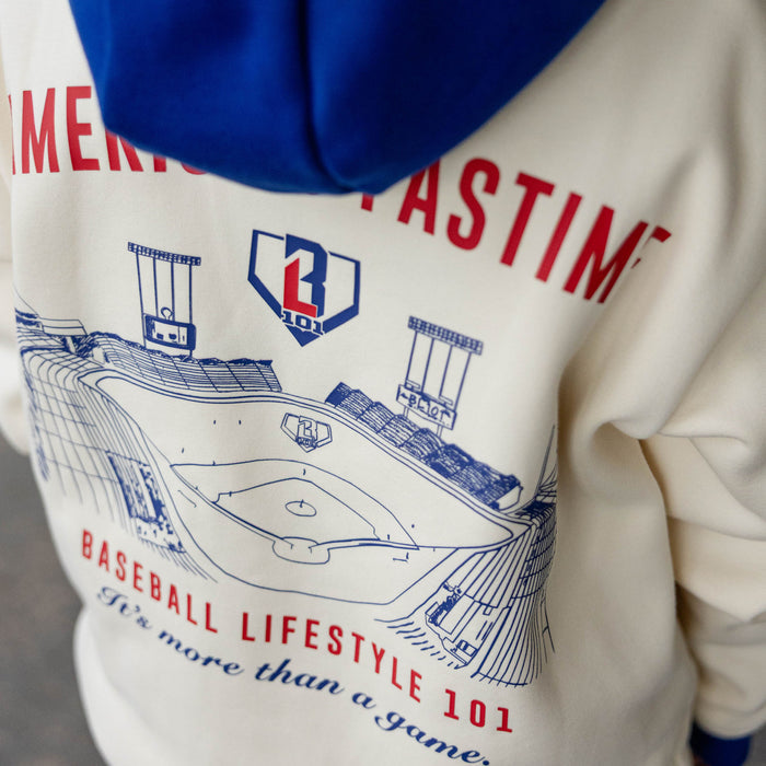 Close up of cream stadium hoodie back graphic featuring a stadium illustration and Baseball Lifestyle 101 It's More Than A Game text