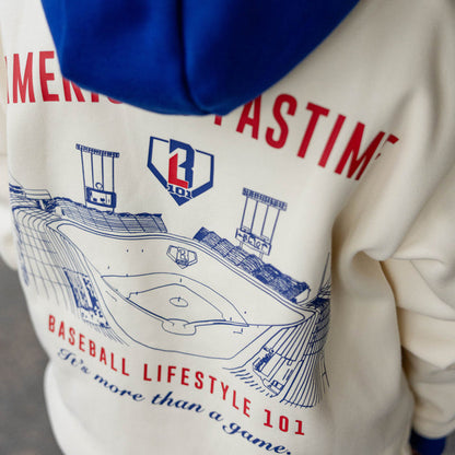 Close up of cream stadium hoodie back graphic featuring a stadium illustration and Baseball Lifestyle 101 It's More Than A Game text