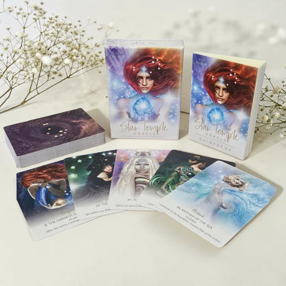 Star Temple tarot cards on a white surface with decorative elements