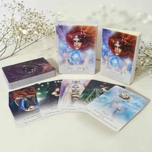 Star Temple tarot cards on a white surface with decorative elements