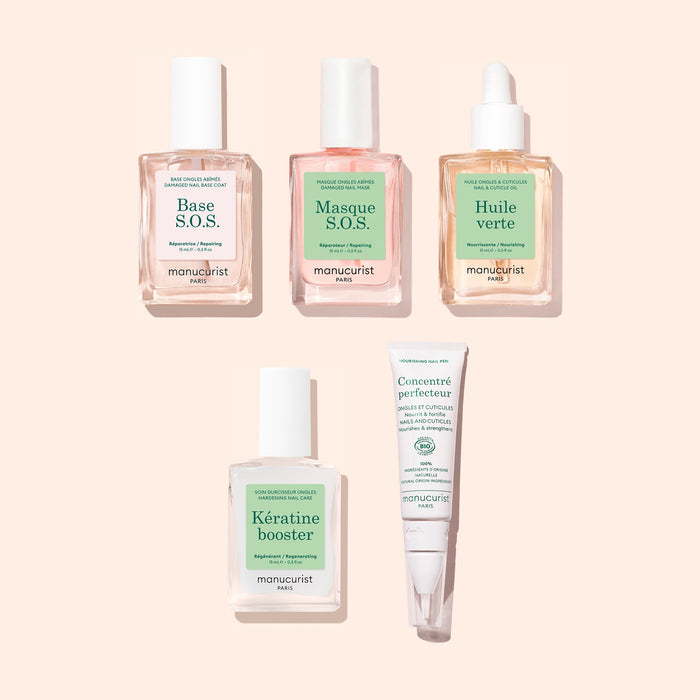 Five products from the Manucurist Starter Routine - Damaged Nails set—including clear and pink bottles with dropper tops for cuticle oil and keratin booster, a white pump bottle, and a white tube designed for nail repair—are arranged neatly on a beige background. Each product features a soft green and white label.