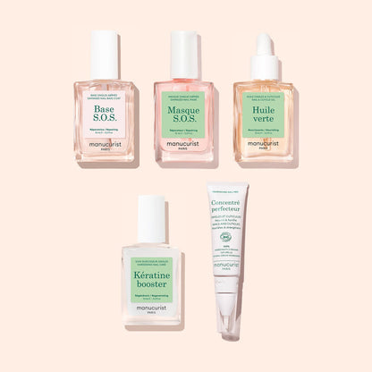 Five products from the Manucurist Starter Routine - Damaged Nails set—including clear and pink bottles with dropper tops for cuticle oil and keratin booster, a white pump bottle, and a white tube designed for nail repair—are arranged neatly on a beige background. Each product features a soft green and white label.
