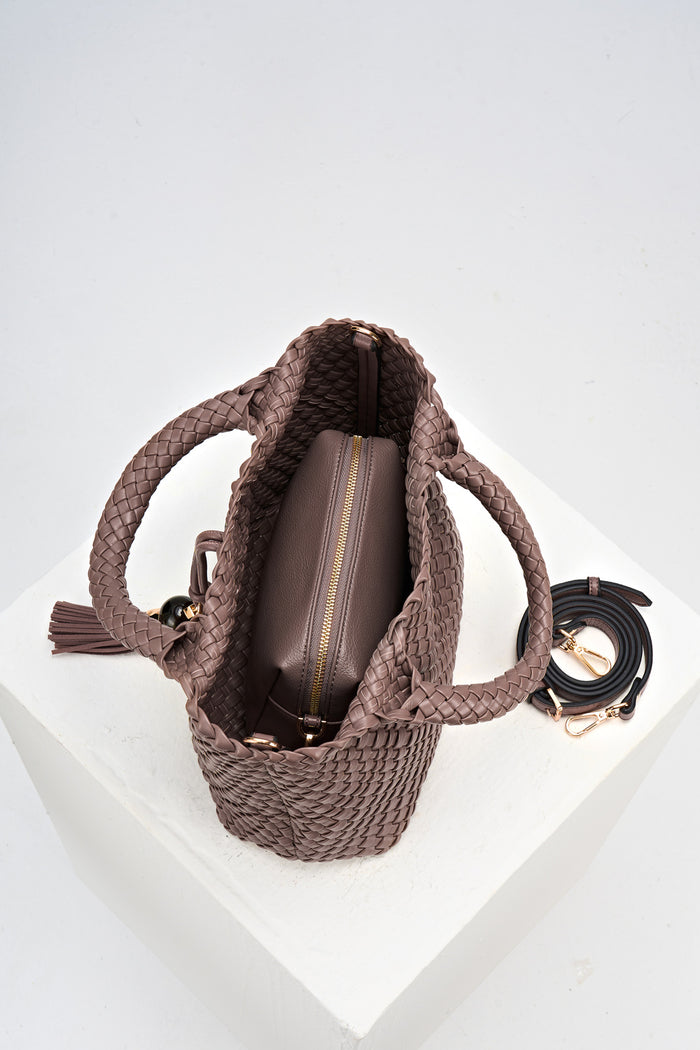 Overhead view of Suky Fawn faux leather Woven Crossbody showing the detachable zipper pouch and detached crossbody strap