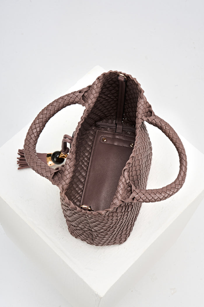 Overhead view of Suky Fawn faux leather Woven Crossbody