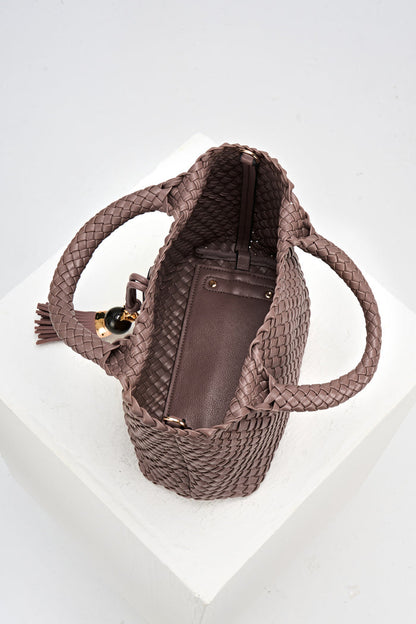 Overhead view of Suky Fawn faux leather Woven Crossbody