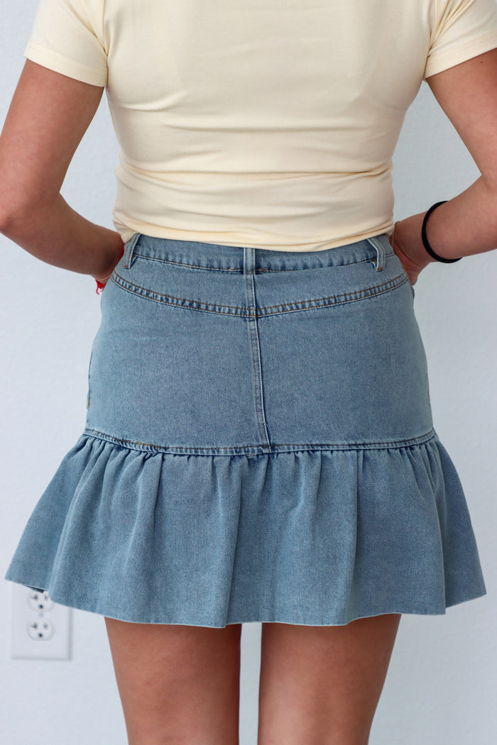 girl wearing denim skirt
