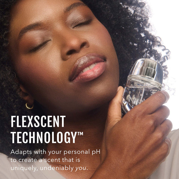 No Makeup Makeup – Woman holding a fragrance bottle with 'FlexScent Technology' text