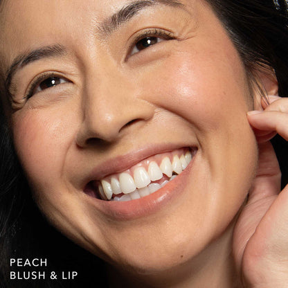 No Makeup Makeup – woman wearing peach blush & lip color on cheeks and lips, natural minimal makeup
