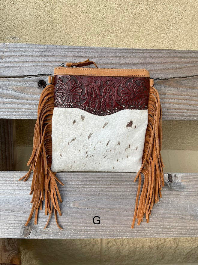 This Brown tooled leather and cowhide bag features side fringe. Front View G