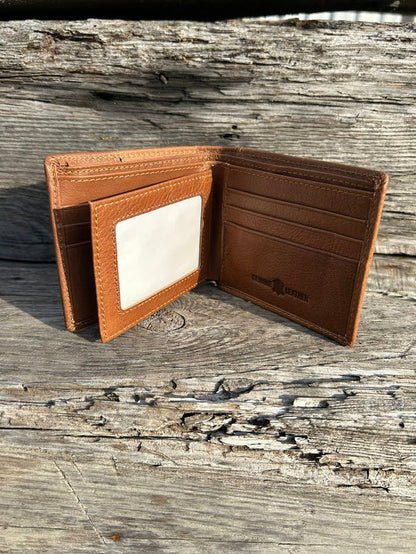 This Brown leather bifold wallet features a cowhide inlay with a Praying Cowboy Concho.  Inside view showing card slots and dual ID window.