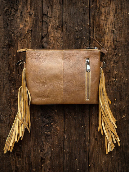 This Brown tooled leather and cowhide purse features a removable adjustable shoulder strap and a zippered closed concealed carry pocket on the rear. Inside it has six card slots and a zippered closed pocket. Rear View