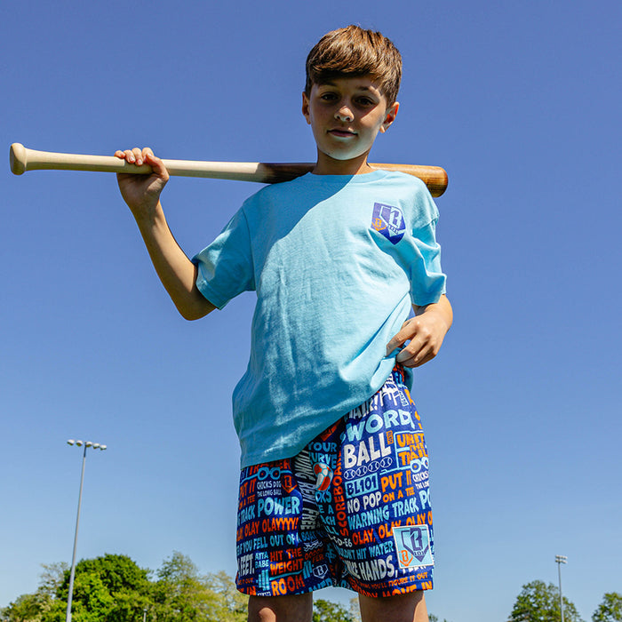 Youth model wearing navy youth shorts with "Trash Talk Youth" design
