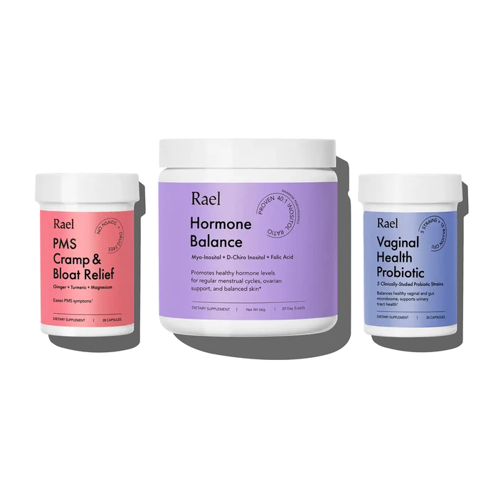 Three supplement jars labeled PMS Cramp & Bloat Relief, Hormone Balance, and Vaginal Health Probiotic by Rael.