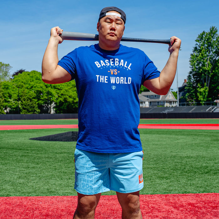Adult model wearing blue shorts with "UVChangeup Trash Talk" design