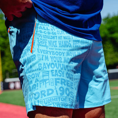 Adult model wearing blue shorts with "UVChangeup Trash Talk" design