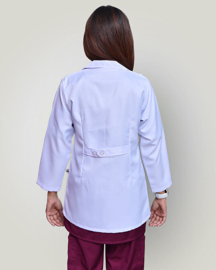 lady shows the back sight of lab coat